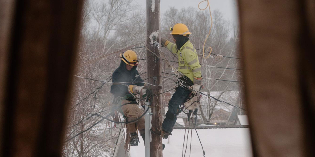 Lineman working in winter storm